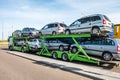 ZELVA, BELARUS - SEPTEMBER 2019: Car carrier truck loaded with many cars in the parking lot