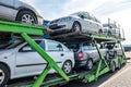 ZELVA, BELARUS - SEPTEMBER 2019: Car carrier truck loaded with many cars in the parking lot