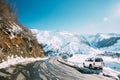Zemo Mleta, Mtskheta-Mtianeti Region, Georgia. Car Parked On Roadside In Sunny Winter Day. Beautiful Georgian Mountains