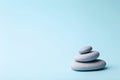 Zen background blue color with Japanese stones stone towers for spa, meditation and relaxation Royalty Free Stock Photo