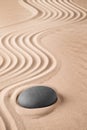 Zen background with stone and pattern of lines in the sand Royalty Free Stock Photo