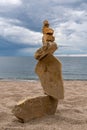 Zen balanced stack of stones on beach Royalty Free Stock Photo