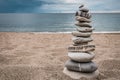 Zen balanced stack of stones on beach Royalty Free Stock Photo