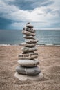 Zen balanced stack of stones on beach Royalty Free Stock Photo