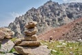 Zen balanced stones stack in high mountains. Pyramidal of stones against the backdrop of a picturesque mountain valley Royalty Free Stock Photo