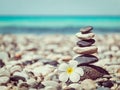 Zen balanced stones stack with plumeria flower Royalty Free Stock Photo