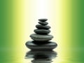 Zen basalt stones with green bamboo on water. Spa and Wellness concept. Royalty Free Stock Photo