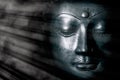 Zen buddhism and spiritual enlightenment. Mindful buddha face mystical light Royalty Free Stock Photo