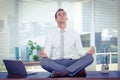 Zen businessman doing yoga meditation Royalty Free Stock Photo