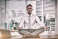 Zen businessman doing yoga meditation Royalty Free Stock Photo