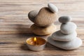 Zen composition with stones and lit candle Royalty Free Stock Photo