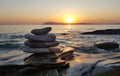 Zen concept. Pebble balance on the beach at sunset. Harmony & Meditation. Zen stones
