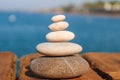 Zen concept. Pyramid of stones on the seashore. Blurred background. Concept of harmony, stability, life balance, and Royalty Free Stock Photo