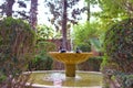 Zen garden in the backyard of a traditional muslim house. Fountain multi-tiered in the garden Royalty Free Stock Photo