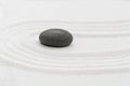 Zen Garden with Grey Stone on White Sand Line Texture Background, Top View Black Rock Sea Stone on Sand Wave Parallel Lines Royalty Free Stock Photo