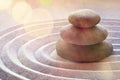 Zen garden meditation stone background with stones and lines in sand for relaxation balance and harmony spirituality or spa Royalty Free Stock Photo