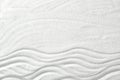 Zen garden pattern on sand as background, top view Royalty Free Stock Photo