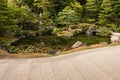 Zen garden with pond and pruned trees Royalty Free Stock Photo