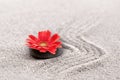 Zen garden with red gerbera flower Royalty Free Stock Photo