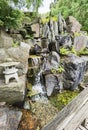 Zen garden waterfall in stones Royalty Free Stock Photo