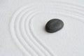 Zen Graden with Grey Stone on White Sand Line Texture Background, Top View Black Rock Sea Stone on Sand Wave Parallel Lines Royalty Free Stock Photo