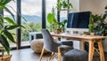 Zen home office with computer in a beautiful, spacious living room interior with plants and an outside view through big windows Royalty Free Stock Photo