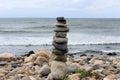 Zen like garden on the beach, with several rocks balanced on one another near the edge of the sea Royalty Free Stock Photo