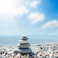 Zen-like stones on beach under sun Royalty Free Stock Photo
