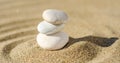 zen meditation stone in sand, concept for purity harmony and spirituality, spa wellness and yoga background Royalty Free Stock Photo