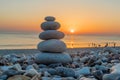Zen pebbles standing on the beach at sunset Royalty Free Stock Photo