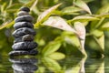 Zen pyramid of stone on the water