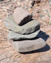 Zen rock pile on drift wood along the shore of Lake Superior Royalty Free Stock Photo