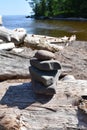 Zen rock pile on drift wood along the shore of Lake Superior Royalty Free Stock Photo