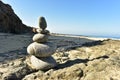 Zen rock stack on Pacific Ocean coast with waves on shore Royalty Free Stock Photo