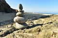 Zen rock stack on Pacific Ocean coast with waves on shore Royalty Free Stock Photo
