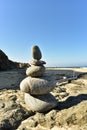 Zen rock stack on Pacific Ocean coast with waves on shore Royalty Free Stock Photo