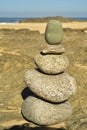 Zen rock stack on Pacific Ocean coast with waves on shore Royalty Free Stock Photo