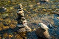 Zen rocks balanced stack of stones in flowing water Royalty Free Stock Photo