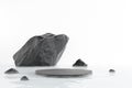 Zen spa stone podium black stone on water surface in pond white mist and water waves in peaceful cool and refreshing nature.