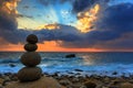 Nature Seascape with Zen Stacked Rocks on Beach at Colorful Sunrise Royalty Free Stock Photo