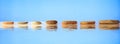 Zen stones row on blue background Royalty Free Stock Photo