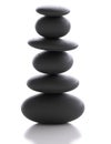 Zen stone - gray sea pebbles pyramid - balanced in harmony stack of stones on white background Royalty Free Stock Photo