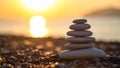 Zen stone stack on a beach at sunset with blurred background. Royalty Free Stock Photo
