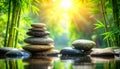 Zen stone stack in tranquil bamboo forest with sun rays and water reflection stones Royalty Free Stock Photo