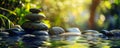 Zen stone stack by a tranquil water pond. Wellness and meditation concept. Design for spa, relaxation poster, wallpaper Royalty Free Stock Photo