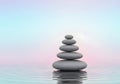 Zen Stone Stack on Water with Pastel Sky Reflection Royalty Free Stock Photo