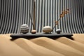 zen stone trio with raked sand waves and bamboo background Royalty Free Stock Photo