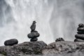 Zen stone at waterfall with blur background