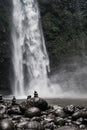 Zen stone at waterfall with blur background