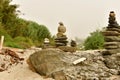 Zen stones. Balance Stones On Stone. Stones balance, pile of pebbles on sand and a bottom of green vegetation Royalty Free Stock Photo